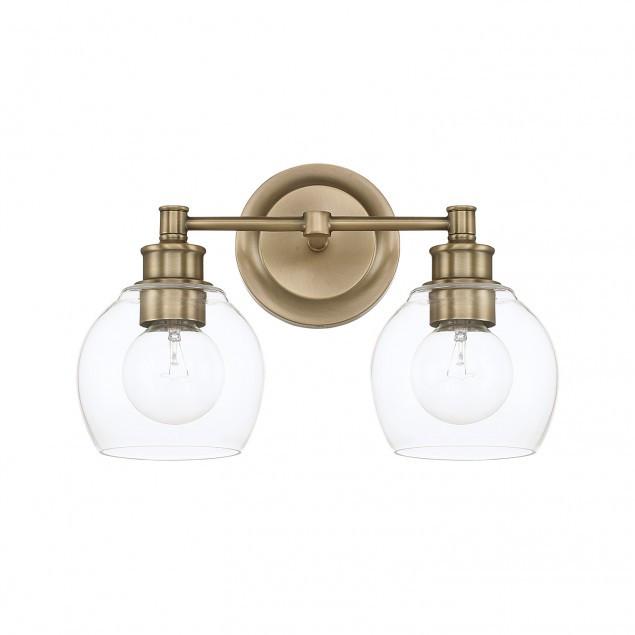 Capital Lighting Mid-Century 2-Light Vanity Light in Aged Brass with clear rounded glass shades by  121121AD-426